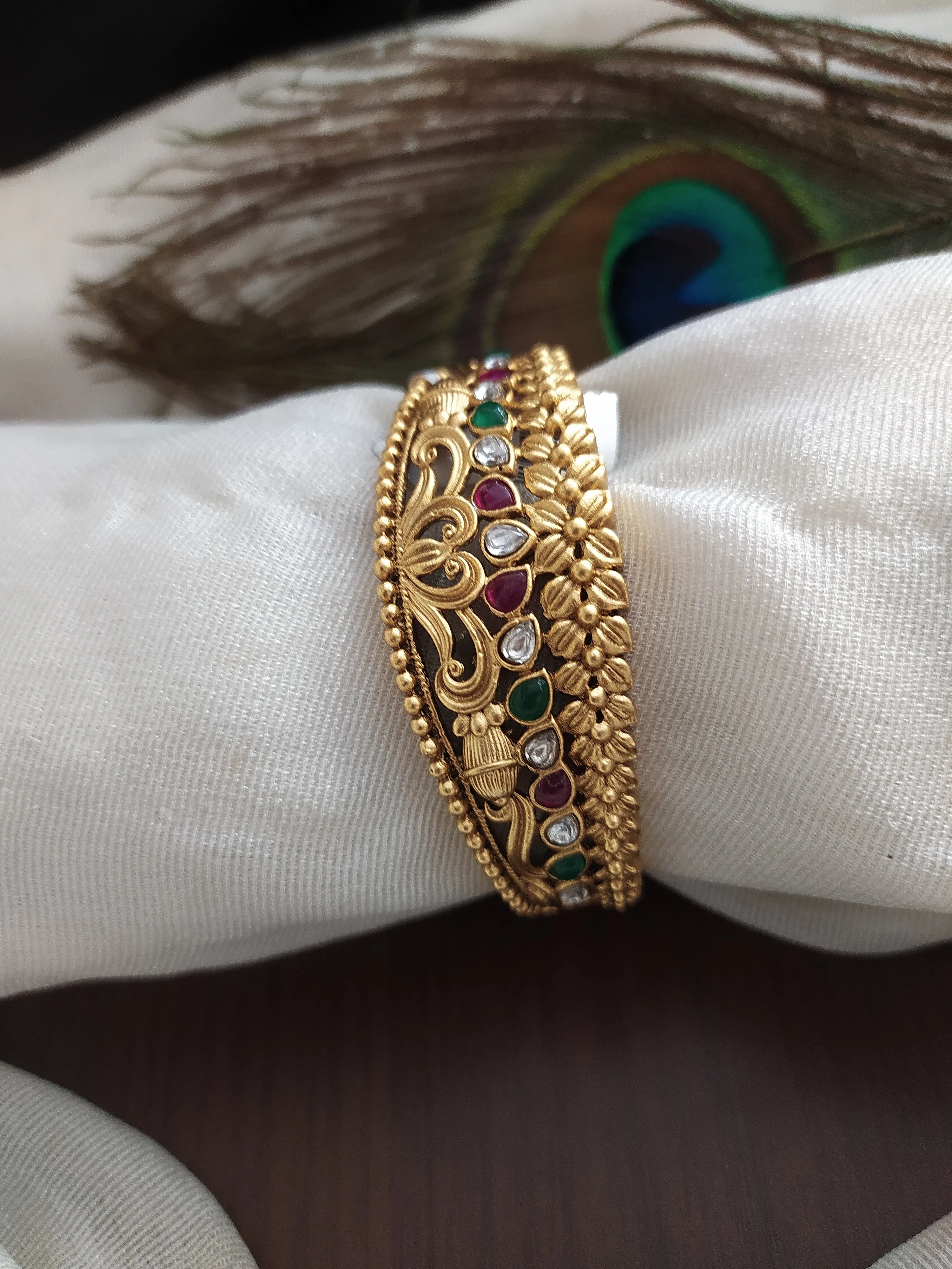 Antique Kada with floral Design with Kemp Stones having ruby and green color