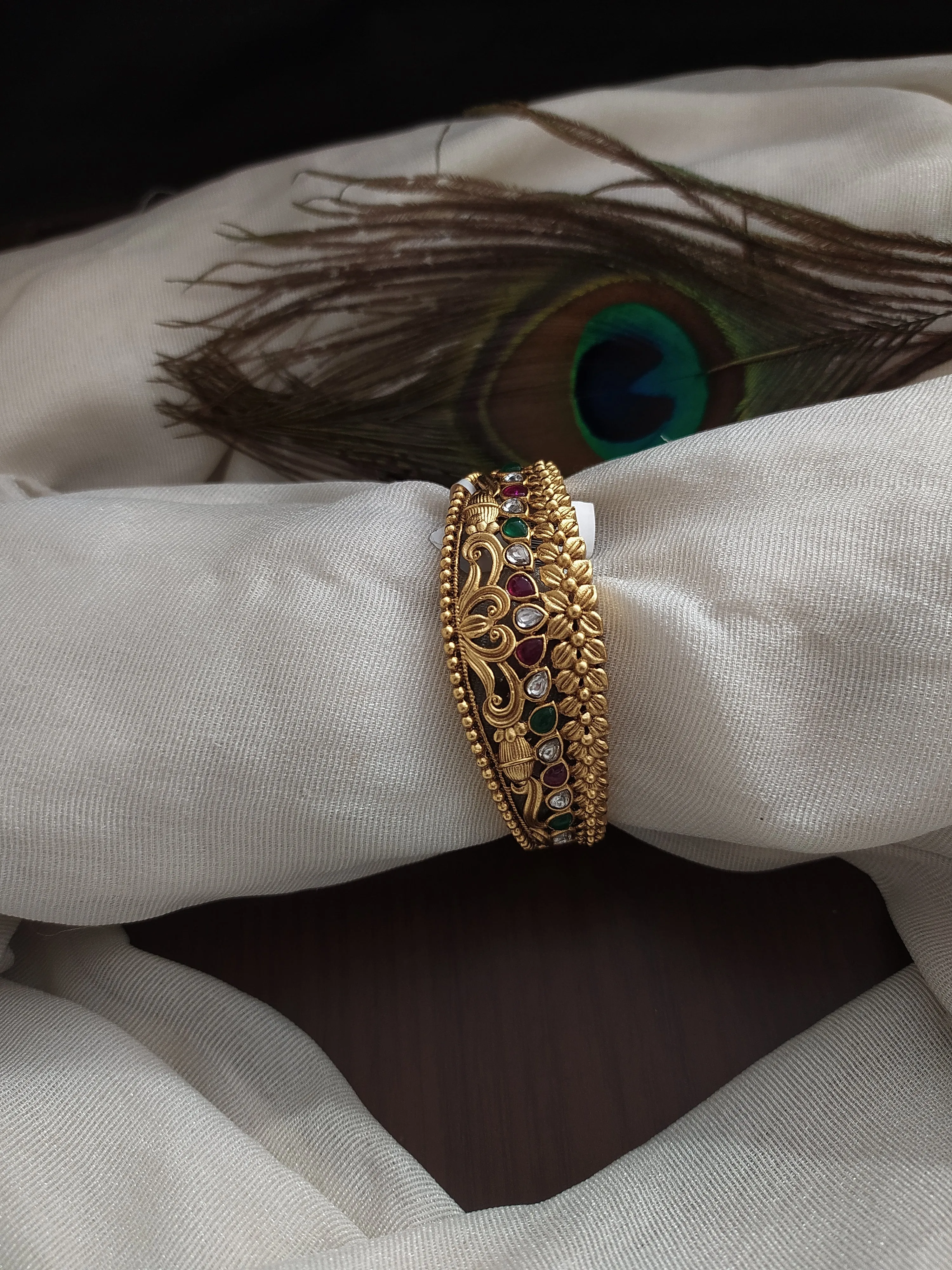 Antique Kada with floral Design with Kemp Stones having ruby and green color
